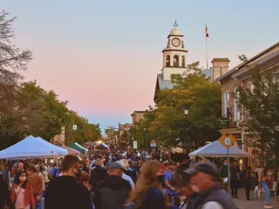 Crowd of people at street festival with Perth Town Hall in the background