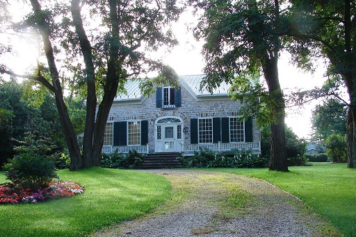 Old stone house with circular driveway