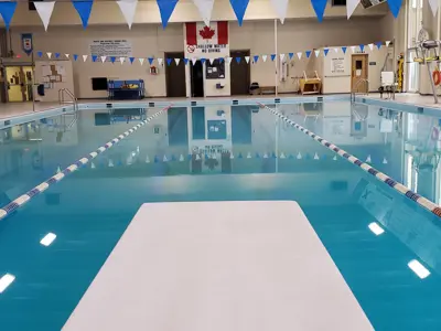 View of indoor pool from diving board